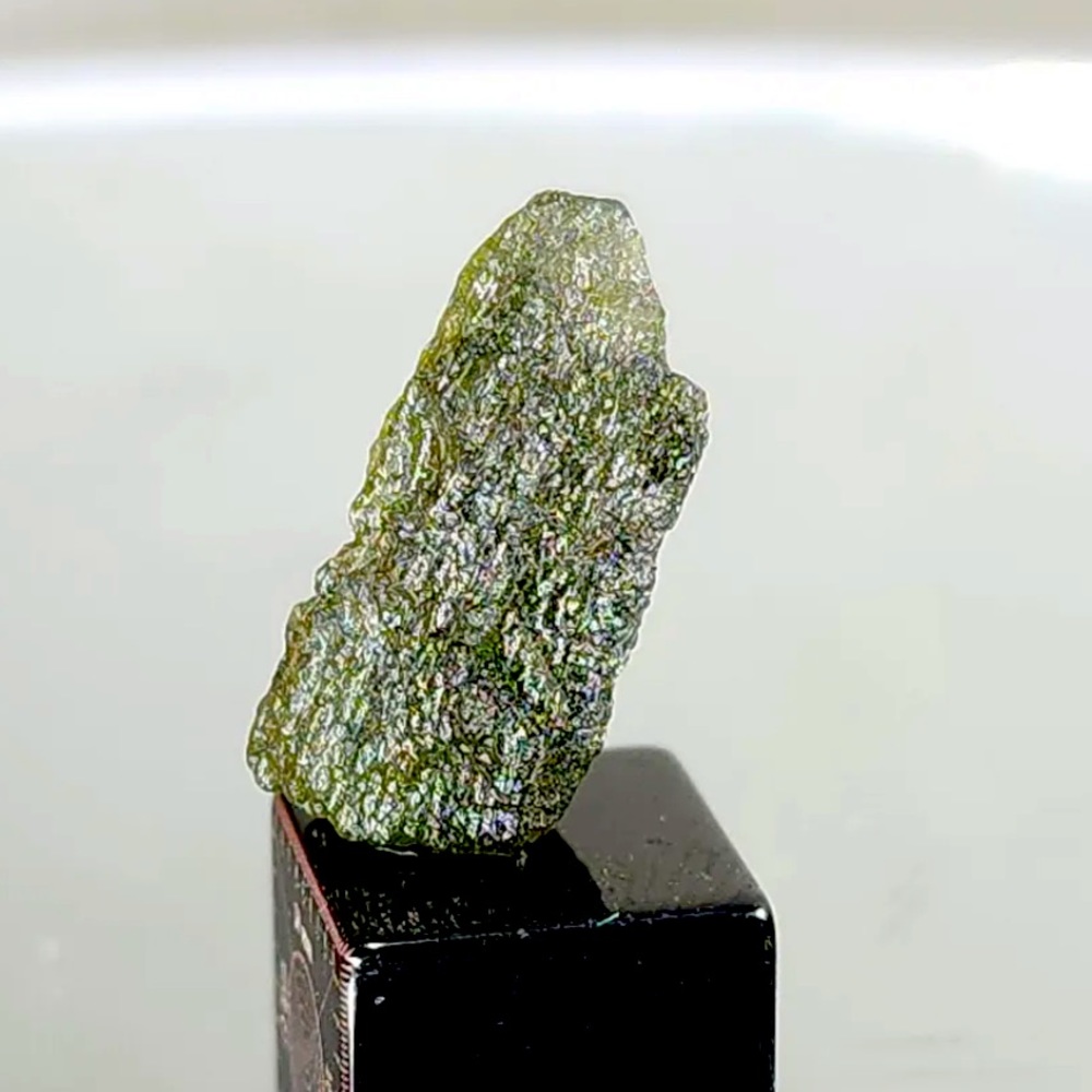 Moldavite .9g/4.5 carats Natural. COA included and stand. Beautiful Green Color.